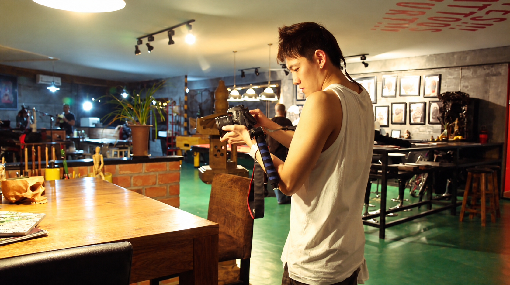Stanley Yang checking his camera on location
