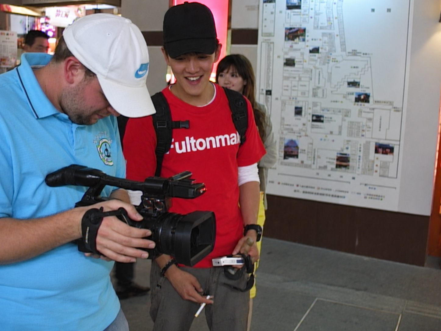 Stanley Yang with a camera crew on location