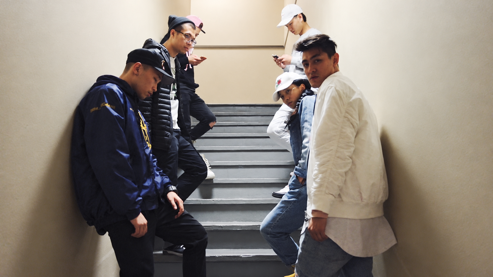 Artists gathered on a staircase