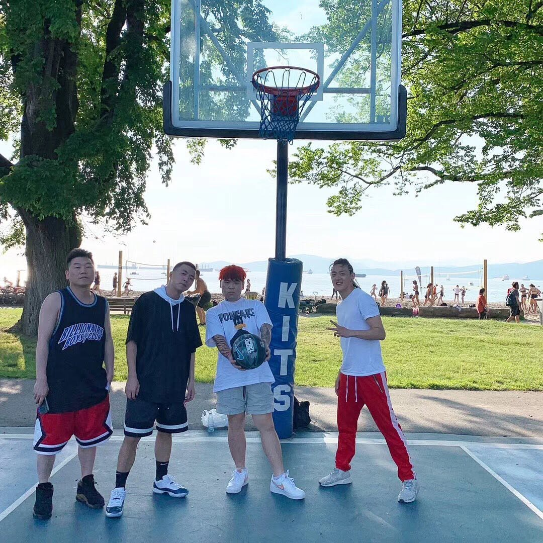 Stanley Yang with friends on a Vancouver basketball court